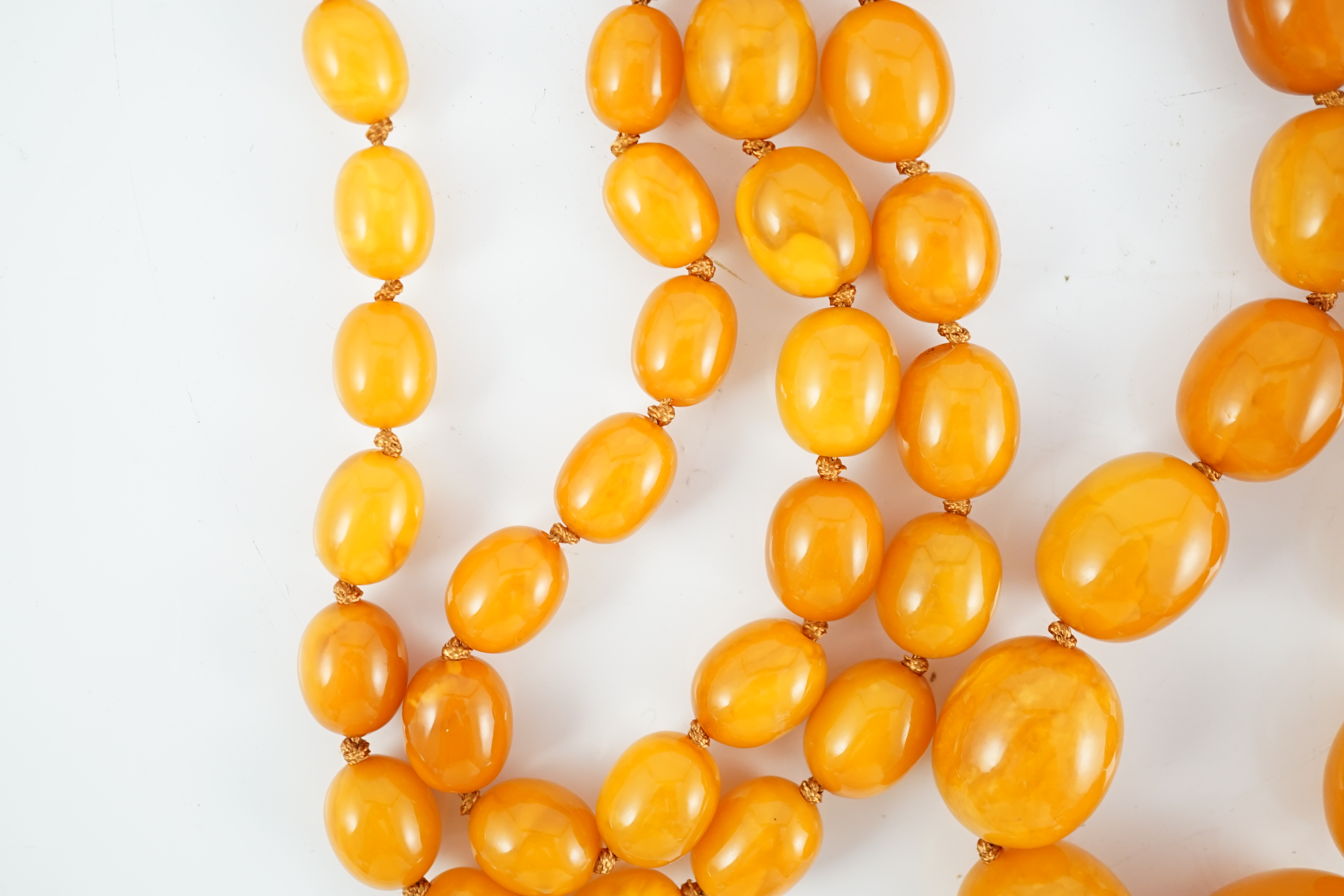 A single strand graduated oval amber bead necklace, 110cm, gross weight 163 grams